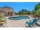 Backyard pool with patio furniture surrounded by lush landscaping at 6102 E Danbury Rd, Scottsdale, AZ 85254