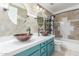 This bathroom features trendy double sinks, modern fixtures, and updated tile and lighting at 6918 W Villa Hermosa W --, Glendale, AZ 85310