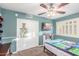 This colorful bedroom features a ceiling fan, plenty of light, and ample space for activities at 6918 W Villa Hermosa W --, Glendale, AZ 85310
