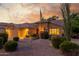 Charming single-story home with manicured landscaping, mature trees, and a welcoming entrance at sunset at 6918 W Villa Hermosa W --, Glendale, AZ 85310