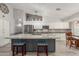 Modern kitchen with large granite island and breakfast bar at 6918 W Villa Hermosa W --, Glendale, AZ 85310