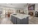 Open concept kitchen and living room with stone fireplace at 6918 W Villa Hermosa W --, Glendale, AZ 85310