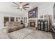 Comfortable living room with stone fireplace and decorative shelving at 6918 W Villa Hermosa W --, Glendale, AZ 85310