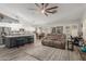 Open concept living room featuring kitchen, dining area, and comfortable sofa at 6918 W Villa Hermosa W --, Glendale, AZ 85310