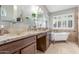 This primary bathroom features separate and sinks and a relaxing soaking tub at 6918 W Villa Hermosa W --, Glendale, AZ 85310