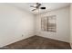A neutrally painted bedroom with carpet and a window for natural light at 700 E Mesquite Cir # O210, Tempe, AZ 85288