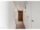 A hallway features neutral paint and carpet, with a closet in the middle at 700 E Mesquite Cir # O210, Tempe, AZ 85288
