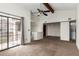 Spacious living area with vaulted ceilings, fan, and sliding doors that let in plenty of light at 700 E Mesquite Cir # O210, Tempe, AZ 85288