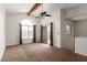 The living room features a large arched window, a ceiling fan, and sliding glass doors at 700 E Mesquite Cir # O210, Tempe, AZ 85288