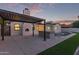 Backyard features a covered patio, outdoor kitchen, and a sparkling pool at 720 E Chilton Dr, Tempe, AZ 85283