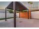 Backyard with a modern pergola and a privacy wall, creating a private outdoor living space at 720 E Chilton Dr, Tempe, AZ 85283