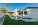 A luxurious backyard oasis with a pool, spa, and lush landscaping for entertaining at 720 E Chilton Dr, Tempe, AZ 85283