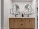 Elegant bathroom with a double sink vanity, modern fixtures, and stylish mirrors at 720 E Chilton Dr, Tempe, AZ 85283