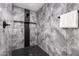 Modern bathroom showcases a beautifully tiled shower with a built-in niche and black fixtures at 720 E Chilton Dr, Tempe, AZ 85283