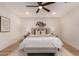 Comfortable primary bedroom featuring warm colors, a ceiling fan and lots of natural light at 720 E Chilton Dr, Tempe, AZ 85283
