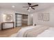Spacious bedroom boasts natural light and neutral finishes with a view to additional storage space at 720 E Chilton Dr, Tempe, AZ 85283