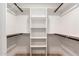 Spacious walk-in closet featuring custom shelving and ample storage, perfect for organization at 720 E Chilton Dr, Tempe, AZ 85283
