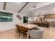 Dining area featuring a light wood table, modern chairs, and an open view into the living room and kitchen at 720 E Chilton Dr, Tempe, AZ 85283