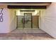 Striking front entryway with modern horizontal slat gate providing curb appeal and privacy at 720 E Chilton Dr, Tempe, AZ 85283