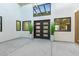 Stylish foyer featuring modern lighting, chic wall decor, and sleek double front doors at 720 E Chilton Dr, Tempe, AZ 85283