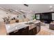 Bright and open kitchen showcases a stainless steel sink, modern appliances and an island bar at 720 E Chilton Dr, Tempe, AZ 85283
