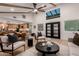 Open-concept living room with vaulted ceilings, exposed beams, hardwood floors and an open kitchen at 720 E Chilton Dr, Tempe, AZ 85283