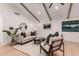 Bright living room boasts vaulted ceilings with wooden beams, modern furniture, and hardwood floors at 720 E Chilton Dr, Tempe, AZ 85283