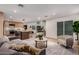 Spacious living room with an open floor plan, modern decor, and access to the kitchen at 720 E Chilton Dr, Tempe, AZ 85283