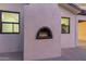 A stucco outdoor fireplace detail adds charm to the property's exterior at 720 E Chilton Dr, Tempe, AZ 85283