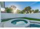Backyard pool and spa surrounded by artificial grass and white block privacy wall at 720 E Chilton Dr, Tempe, AZ 85283