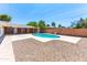 The backyard features a refreshing pool and patio area, surrounded by gravel for easy maintenance at 724 W Missouri Ave, Phoenix, AZ 85013