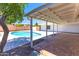 Backyard boasts a covered patio and a refreshing pool, perfect for outdoor entertaining and relaxation at 724 W Missouri Ave, Phoenix, AZ 85013