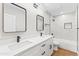 Renovated bathroom features dual vanity, quartz countertop, and elegant framed mirrors at 724 W Missouri Ave, Phoenix, AZ 85013