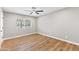 A bright bedroom is decorated with wood laminate floors and a ceiling fan at 724 W Missouri Ave, Phoenix, AZ 85013
