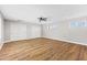 Spacious bedroom featuring wood floors, neutral walls, a ceiling fan and natural light at 724 W Missouri Ave, Phoenix, AZ 85013