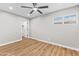 A bright bedroom with wood laminate flooring is equipped with a ceiling fan at 724 W Missouri Ave, Phoenix, AZ 85013