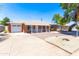 Inviting red brick home with a white picket fence, single car garage and mature shade tree at 724 W Missouri Ave, Phoenix, AZ 85013