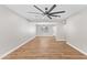 Bright living room featuring hard surface floors, ceiling fan and a seamless transition to the kitchen at 724 W Missouri Ave, Phoenix, AZ 85013