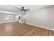 Bright living room featuring hard surface floors, ceiling fan and a seamless transition to the kitchen at 724 W Missouri Ave, Phoenix, AZ 85013