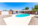The backyard showcases a refreshing pool surrounded by a white concrete patio, perfect for sunny days at 724 W Missouri Ave, Phoenix, AZ 85013