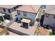 An aerial view of the backyard, which features stone landscaping and a covered patio area at 7712 S 64Th Ln, Laveen, AZ 85339