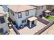 View of a private backyard with stone landscaping and a covered patio area with grill and seating at 7712 S 64Th Ln, Laveen, AZ 85339