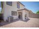 Low-maintenance backyard with a covered patio is perfect for outdoor enjoyment and features desert-style landscaping at 7712 S 64Th Ln, Laveen, AZ 85339