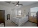 Bedroom with neutral decor, ceiling fan, and plush carpet at 7712 S 64Th Ln, Laveen, AZ 85339
