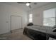 Well-lit bedroom with a closet and two windows, providing ample natural light at 7712 S 64Th Ln, Laveen, AZ 85339
