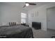Comfortable bedroom featuring a ceiling fan, large bed, and bright natural light at 7712 S 64Th Ln, Laveen, AZ 85339