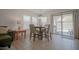 Dining area with tile floors, neutral paint and sliding patio doors at 7712 S 64Th Ln, Laveen, AZ 85339