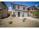 Inviting two-story residence with neat landscaping and a classic design, complete with a two-car garage at 7712 S 64Th Ln, Laveen, AZ 85339