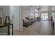 Open concept living room and dining area with tile floors and lots of natural light at 7712 S 64Th Ln, Laveen, AZ 85339