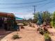 Spacious backyard featuring decorative windmill, plants and a covered area at 8116 N 55Th Dr, Glendale, AZ 85302